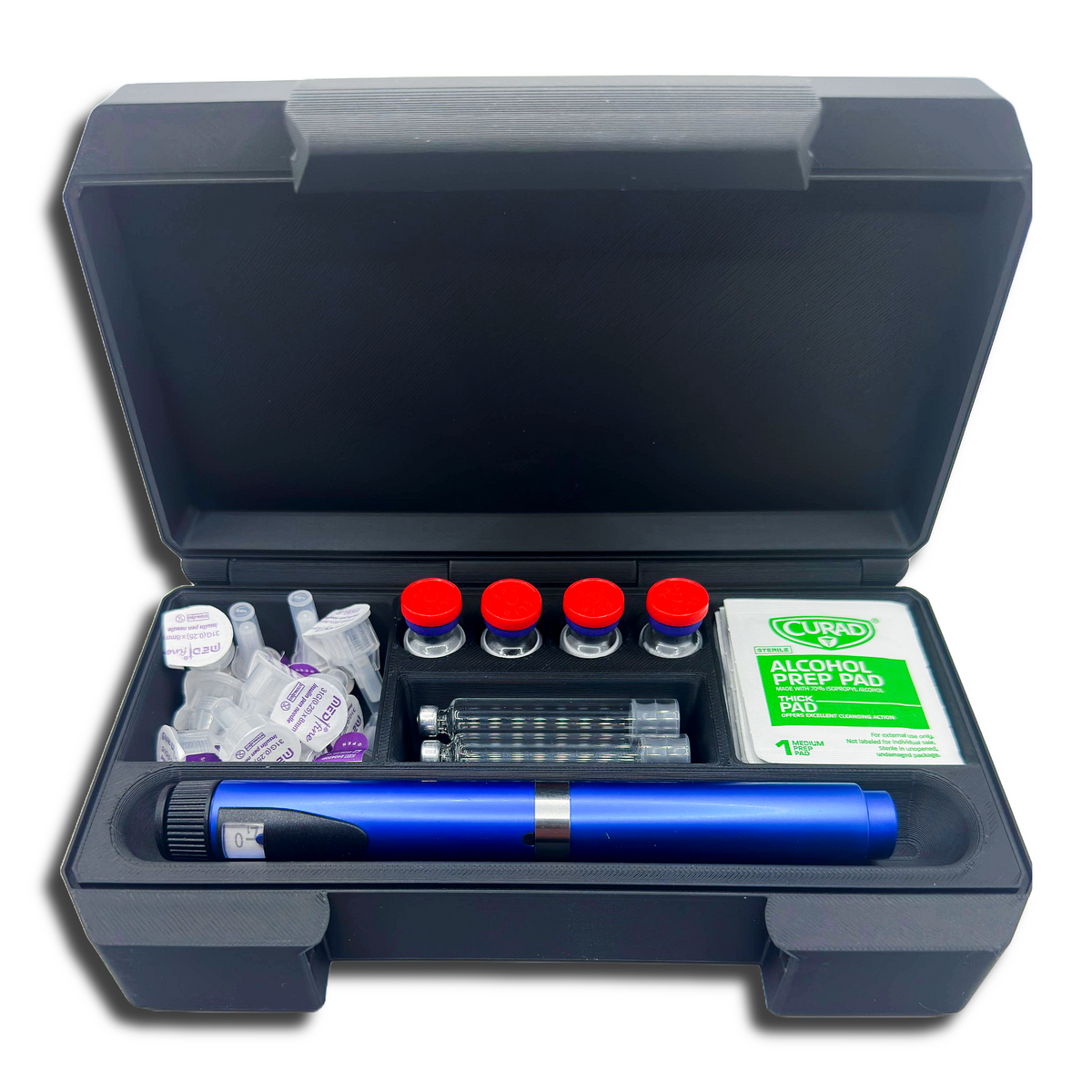 Black storage case open to display a blue injection pen, four 3ml vials with red caps, two cartridges, alcohol prep pads, and multiple pen needle tips. Each item fits into its own molded compartment within the case, offering organized storage for insulin or peptide routines at home or during travel.