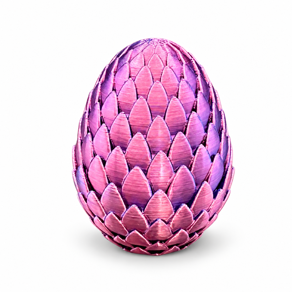 Closed pink and purple dragon egg vial holder showing its scale-patterned exterior.