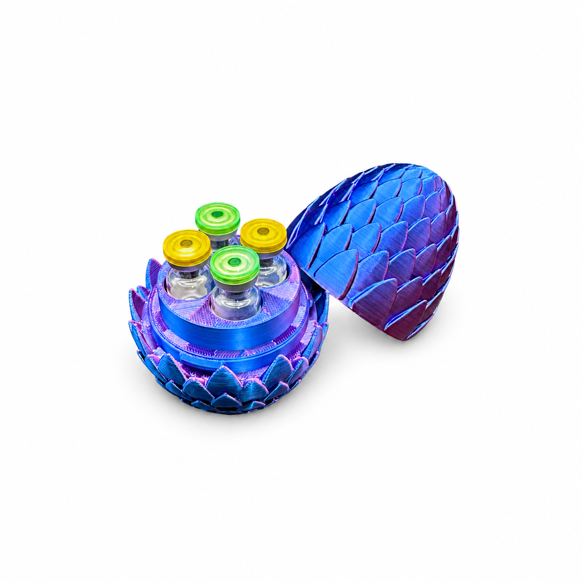 Open blue and purple dragon egg 3ml vial holder with four demonstration vials, two green caps and two yellow caps, and its matching lid tilted beside the base.