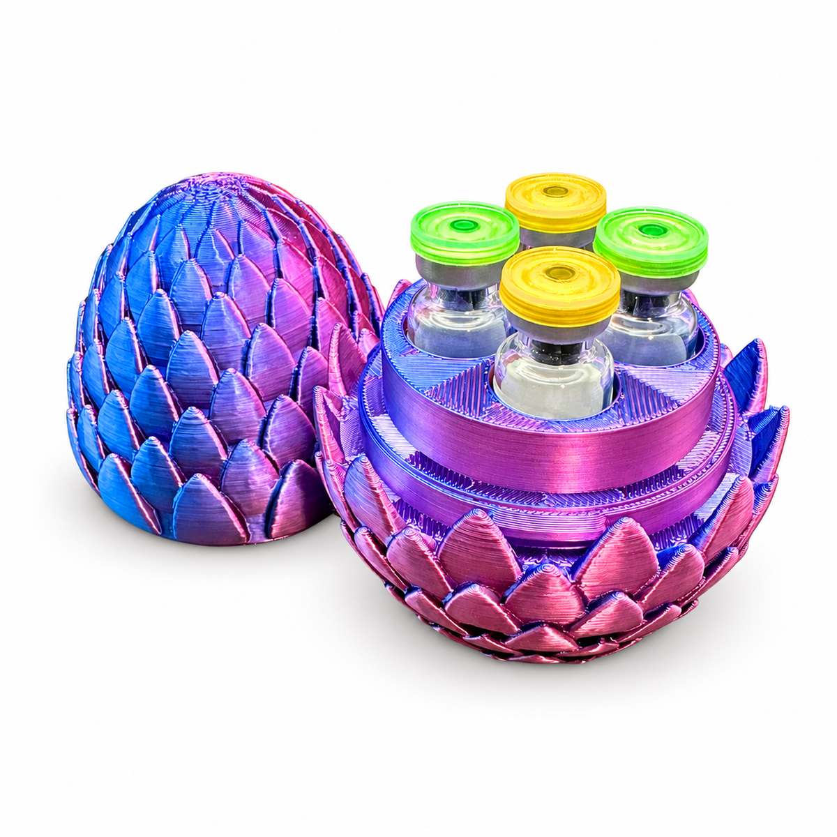 Open purple and blue four-slot vial holder with four glass demonstration vials and its lid standing beside it. Vials are not included.