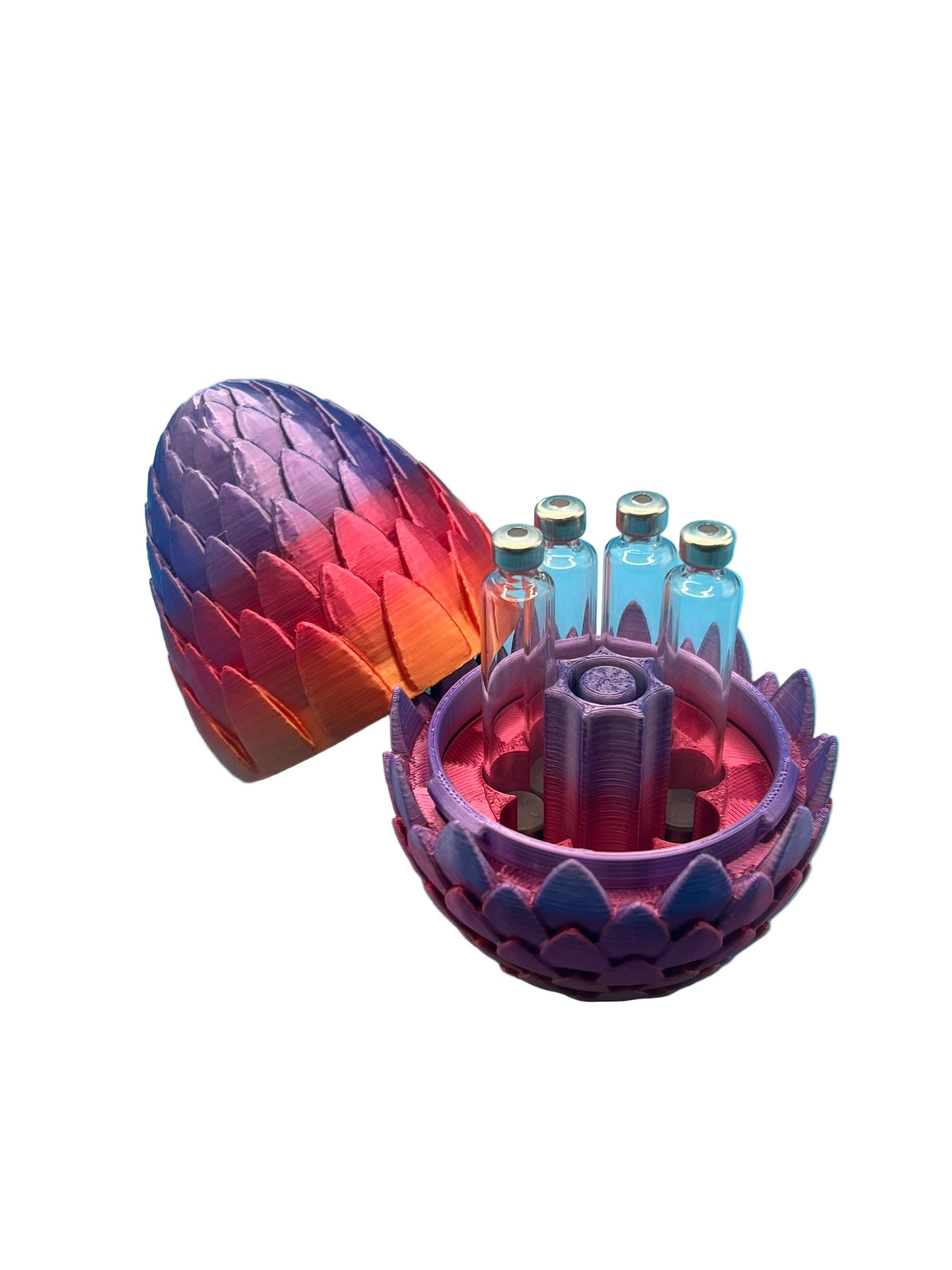 Open dragon egg cartridge holder in vibrant red, orange, and purple gradient, displaying seven glass 3ml cartridges surrounding a central purge tower.