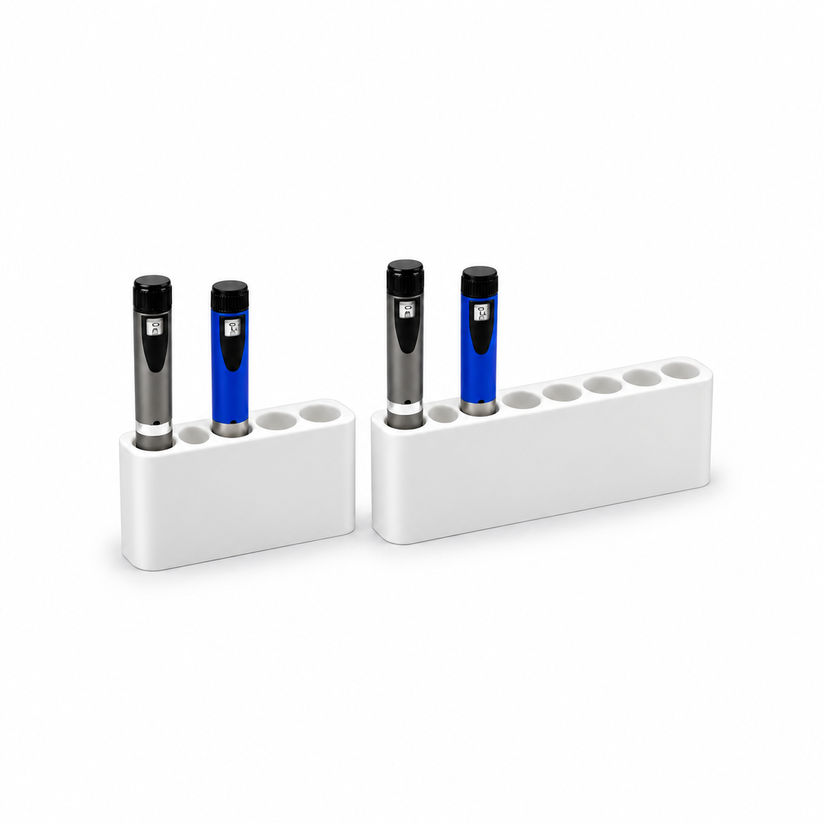 Five-slot and eight-slot white fridge pen holders together with demonstration pens.