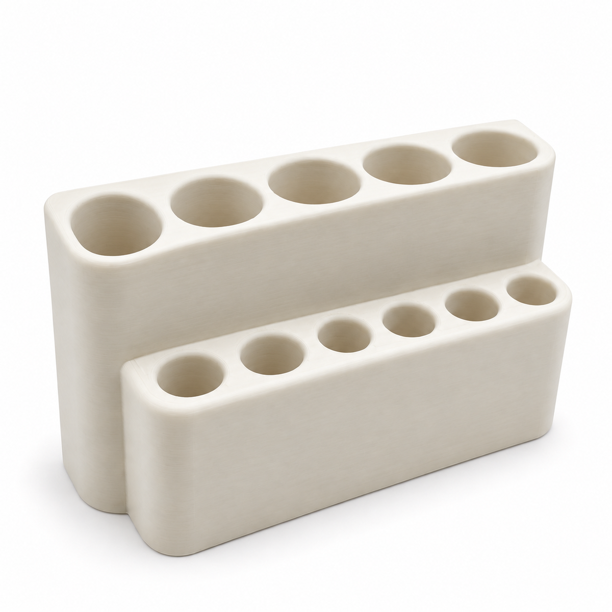 Empty ivory fridge organizer with five pen openings and six cartridge slots on a white background.