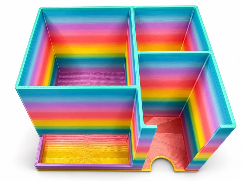 Empty rainbow injection pen organizer showing its three compartments and front dispensing openings.