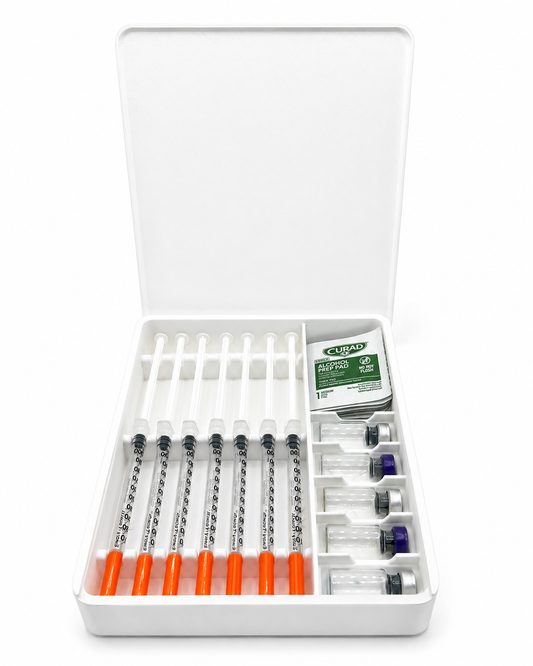 White Layered Vault seven-day storage case with seven demonstration syringes, five 3mL vials and wipes; supplies not included.