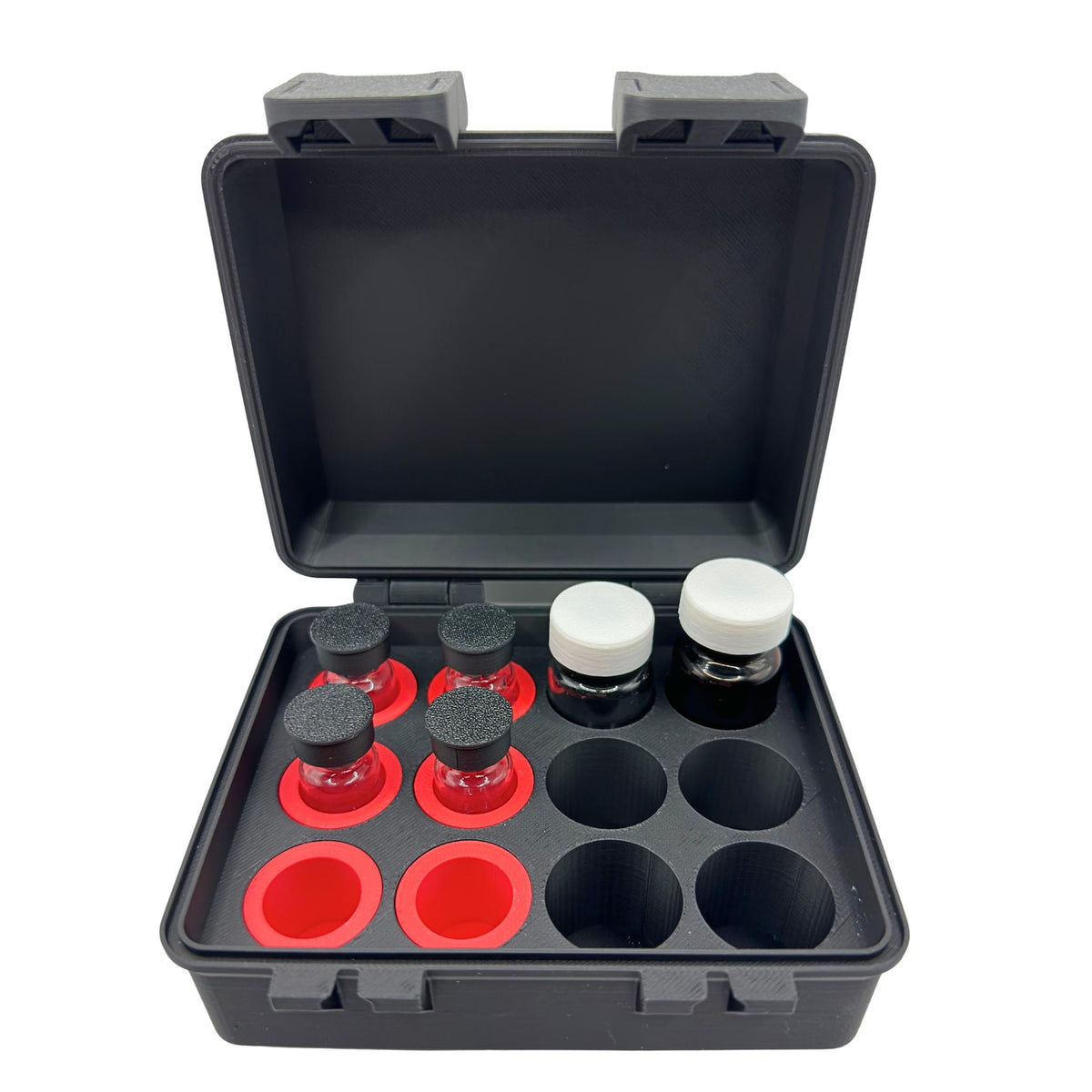 Open vial case showing mixed-size vial positions and removable adapters.