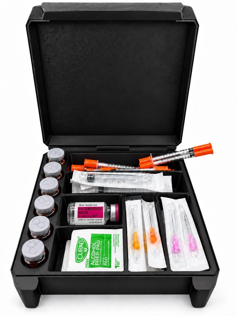 Front view of the open six-vial case with syringes, packaged needles, prep pads and a BAC water bottle arranged in separate sections.