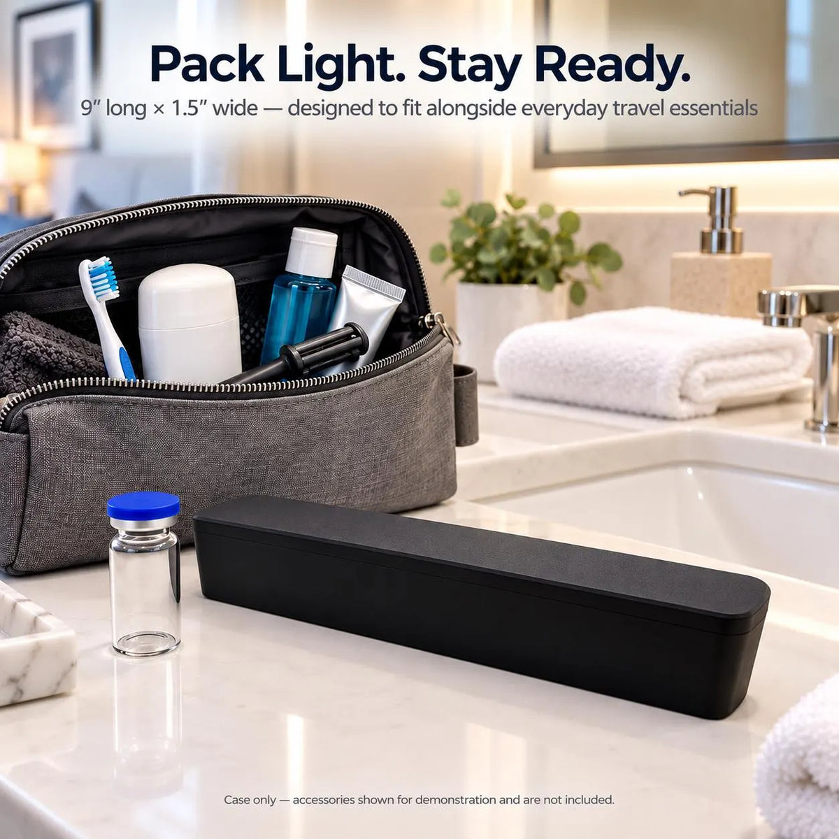 Closed black slim travel case beside a blue-capped vial and toiletry bag on a bathroom counter.