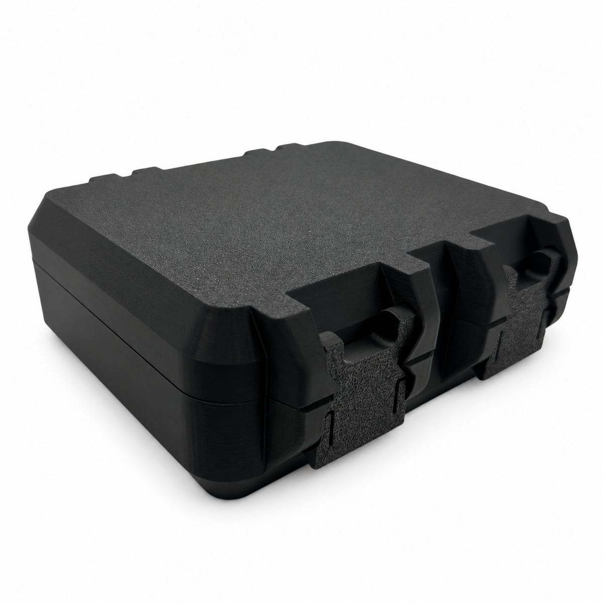 Closed black TRT supply storage case with dual latches on a white background.